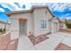 Single story home with a neutral colored stucco exterior, desert landscaping, and an attached single car garage at 2029 Rose Coral Ave, Las Vegas, NV 89106