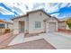 Single story home with a neutral colored stucco exterior, desert landscaping, and an attached single car garage at 2029 Rose Coral Ave, Las Vegas, NV 89106