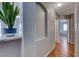 Hallway featuring a plant, neutral walls, wood floors, and an archway at 2029 Rose Coral Ave, Las Vegas, NV 89106