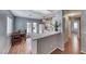 Kitchen with light gray walls, wood flooring, white appliances, and a breakfast bar at 2029 Rose Coral Ave, Las Vegas, NV 89106