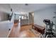 Open concept living room with light gray walls, wood flooring, and a breakfast bar overlooking the kitchen at 2029 Rose Coral Ave, Las Vegas, NV 89106