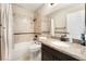 Cozy bathroom featuring a shower-tub combo, granite countertops, and a neutral color palette at 2057 Wandering Doe Ln, Las Vegas, NV 89134