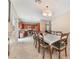 Open floor plan combining the dining area and kitchen with tile flooring throughout at 2057 Wandering Doe Ln, Las Vegas, NV 89134