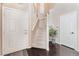 Welcoming foyer with staircase and wood flooring at 2057 Wandering Doe Ln, Las Vegas, NV 89134