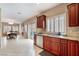 Open concept kitchen with granite countertops and stainless steel appliances at 2057 Wandering Doe Ln, Las Vegas, NV 89134