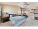 Spacious main bedroom with vaulted ceilings, ceiling fan, barn doors, and a serene, relaxing atmosphere at 2057 Wandering Doe Ln, Las Vegas, NV 89134