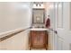 Charming powder room with a decorative mirror, elegant vanity, and a well-maintained interior at 2057 Wandering Doe Ln, Las Vegas, NV 89134