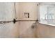Bright shower with mosaic tilework, built-in niche, handheld sprayer, and a window for natural light at 2057 Wandering Doe Ln, Las Vegas, NV 89134
