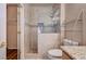Updated bathroom features a glass enclosed shower with stone mosaic tile accents at 2516 Evansville Ave, Henderson, NV 89052