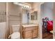 Updated bathroom with granite counters, oak cabinets and modern lighting at 2516 Evansville Ave, Henderson, NV 89052