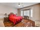 Bright bedroom boasts hardwood floors, ceiling fan and decorative furnishings at 2516 Evansville Ave, Henderson, NV 89052