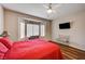 Spacious bedroom features hardwood floors, ceiling fan and large sunny window at 2516 Evansville Ave, Henderson, NV 89052