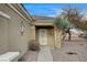 Close up of the front door with decorative accents and desert landscaping at 2516 Evansville Ave, Henderson, NV 89052