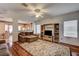 Spacious living room with hardwood floors, neutral paint, and an entertainment center at 2516 Evansville Ave, Henderson, NV 89052