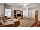 Comfortable living room featuring hardwood floors, neutral paint, and an entertainment center at 2516 Evansville Ave, Henderson, NV 89052
