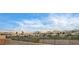 Scenic neighborhood view featuring well-maintained homes, mature landscaping, and mountain views in the background at 2516 Evansville Ave, Henderson, NV 89052