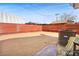 Spacious backyard featuring gravel landscaping, privacy fencing, and outdoor seating area at 274 Aztec Ln, Henderson, NV 89015