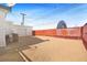 Wide shot of gravel backyard with shed, fencing and AC unit at 274 Aztec Ln, Henderson, NV 89015
