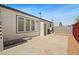 Cement patio leading to gravel yard with gated fence at 274 Aztec Ln, Henderson, NV 89015