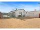 Large backyard with gravel landscaping and a detached one-car garage at 274 Aztec Ln, Henderson, NV 89015