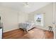Bright bedroom featuring a canopy bed, hardwood floors, and natural light at 274 Aztec Ln, Henderson, NV 89015