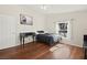 Bedroom features wood floors, a window, and a desk at 274 Aztec Ln, Henderson, NV 89015