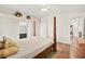 A bright bedroom with a four-poster bed, hardwood floors and ensuite bathroom access at 274 Aztec Ln, Henderson, NV 89015