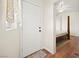 Home entryway featuring hardwood floors, natural light, and a partial view of the bedroom at 274 Aztec Ln, Henderson, NV 89015