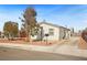 Charming single-story home with a well-maintained yard and long concrete driveway at 274 Aztec Ln, Henderson, NV 89015