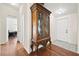 Hallway featuring hardwood floors and an ornate cabinet at 274 Aztec Ln, Henderson, NV 89015