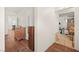 Hallway with wood floors and classic furniture leading to other rooms at 274 Aztec Ln, Henderson, NV 89015