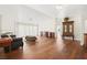 Bright living room featuring hardwood floors, a fireplace, and an open layout for entertaining at 274 Aztec Ln, Henderson, NV 89015