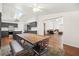 Open concept living space including kitchen, dining and living room with a fireplace at 274 Aztec Ln, Henderson, NV 89015