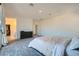 Spacious bedroom featuring carpet, a dark dresser, closet, and ensuite bathroom access at 290 Mount Tyndall St, Henderson, NV 89015