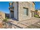 Inviting front entrance with stone accents and a well-maintained, decorative brick walkway at 290 Mount Tyndall St, Henderson, NV 89015