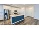 Bright kitchen with stainless steel appliances, stylish island, and plenty of cabinet space at 290 Mount Tyndall St, Henderson, NV 89015