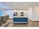 Open-concept kitchen and dining area featuring a large island and stainless steel appliances at 290 Mount Tyndall St, Henderson, NV 89015