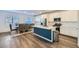 Open-concept kitchen and dining area featuring a large island and stainless steel appliances at 290 Mount Tyndall St, Henderson, NV 89015