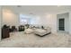 Spacious living room features neutral tones and plush carpet, perfect for relaxation at 290 Mount Tyndall St, Henderson, NV 89015