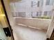 View of a balcony seen through a screen door at 3083 Casey Dr # 101, Las Vegas, NV 89120