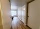 Hallway leads to the bedroom with a large window and neutral colored walls at 3083 Casey Dr # 101, Las Vegas, NV 89120