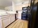 Modern kitchen with stainless steel appliances and wood-look flooring at 3083 Casey Dr # 101, Las Vegas, NV 89120