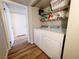 Convenient laundry room with a washer, dryer, and shelving for storage at 3083 Casey Dr # 101, Las Vegas, NV 89120