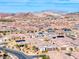 Expansive aerial shot of a well-planned neighborhood featuring uniform homes and mountain views at 314 Meadow Brush Pl, Henderson, NV 89011