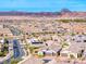 Panoramic aerial perspective of a suburban community showcasing orderly streets and desert mountain backdrop at 314 Meadow Brush Pl, Henderson, NV 89011
