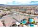 Aerial view of a neighborhood with many single Gathering homes and desert landscape at 314 Meadow Brush Pl, Henderson, NV 89011