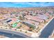 Wide aerial of a neighborhood with similar homes. Many have private pools and desert landscaping at 314 Meadow Brush Pl, Henderson, NV 89011