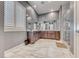 Modern bathroom features marble countertops, large mirrors, and a glass-enclosed shower at 314 Meadow Brush Pl, Henderson, NV 89011