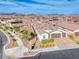 Aerial view of a 3-car garage home with desert landscaping on a street corner at 314 Meadow Brush Pl, Henderson, NV 89011