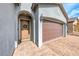 Charming front entrance with a light wood door, brick pavers, and a two car garage at 314 Meadow Brush Pl, Henderson, NV 89011